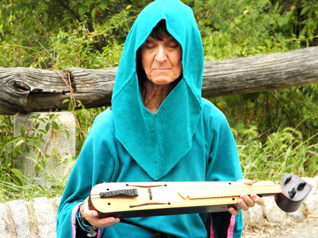 Hooded Woman with a Lute